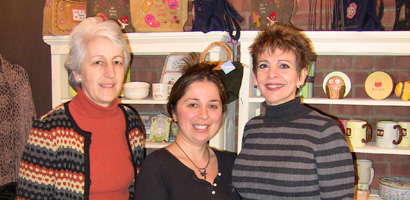 Center; Bella Stockler, owner of Bella’s Boutique, left; Francesca Spinner and on right Marian Randazzo of the Neighborhood House.