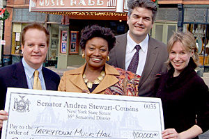 State Senator Andrea Stewart-Cousins presents a $100,000 state grant to Stephen Ballas, Music Hall Board President, Björn Olsson, Executive Director, and Karina E. Ringeisen, Theatre Manager. Photo : Maureen Fleming