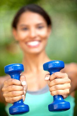 Girl holding weights