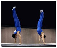 Men on parallel bars