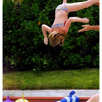 Girl jumping in pool