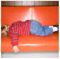 Kid sleeping on sofa