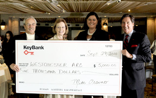 Proceeds from the 2010 Key4Women Forum and a gift from KeyBank, totaling $5,000, were donated to Westchester Arc. Pictured, left to right: Larry McNaughton, board president, Westchester Arc; Anne Sweazey, executive director, Westchester Arc; Ruth Mahoney, newly appointed president of KeyBank's Hudson Valley/Metro NY District; and Mike Orsino, retiring president of KeyBank's Hudson Valley/Metro NY District.