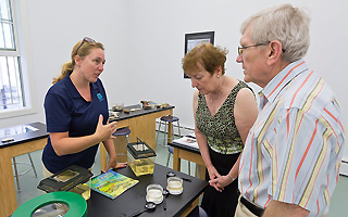 Scenic Hudson Environmental Education Coordinator Susan Hereth talks with John and Constance Curran about educational programming that will be offered in the new center. The Currans donated funds to create the center’s environmental classrooms.