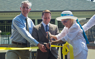 From left, Scenic Hudson President Ned Sullivan, Westchester County Executive Robert P. Astorino and Kathryn W. Davis cut a ribbon to mark completion of renovations of the historic Sleepy Hollow bathhouse now known as the Kathryn W. Davis RiverWalk Center.