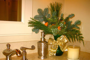 Special touches like an arrangement in the powder room give your home a festive feel