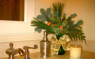 Special touches like an arrangement in the powder room give your home a festive feel