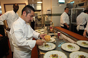 Executive Chef Chiharu Takei putting final touches to the Lobster and Seasonal Vegetables Terrine.