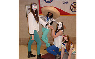 (L-R) Rebecca Strauss, Komal Keerthy, Olivia Banc and Kylie Elwood act out a scene from their award-winning Destination Imagination mime presentation.