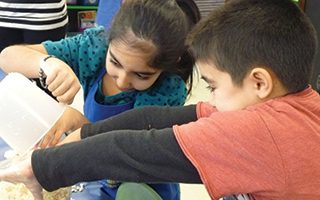 Second graders create popcorn at Todd Elementary School.