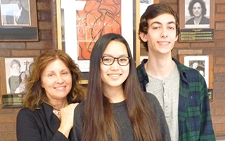 BHS visual arts coordinator  and teacher  Roxanne  Ritacco  congratulates BHS sophomore Maya Ponzini  and junior  David Kaminsky on being awarded Scholastic’s Art and Writing  Regional Gold Key Awards for their oil painting.