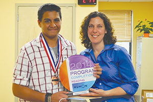 Kumon of Tarrytown’s instructor, Lillian Brijeski proudly presenting the center's first Reading Program Completion Award to Kieran Clifford, age 14.