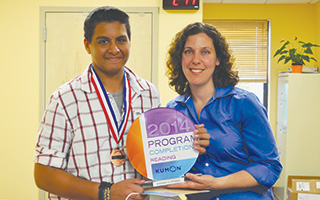 Kumon of Tarrytown’s instructor, Lillian Brijeski proudly presenting the center's first Reading Program Completion Award to Kieran Clifford, age 14.