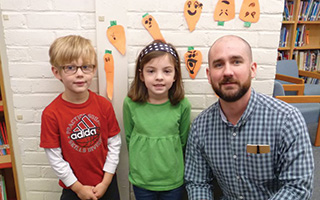 Todd School Kindergarteners  Ryder Ludwig, Caroline Pastore,  and author Peter Brown.