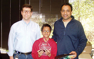 Challenge winner Rishikesh Madabhushi with his father and BASF Vice President  of Innovation and Technology  Michael Pcoliniski.