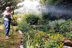 Hedi Eulau tending the garden by the Tarrytown Lakes.