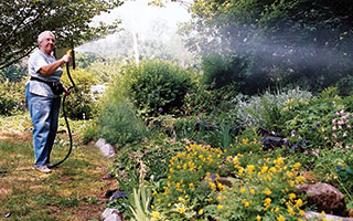 Hedi Eulau tending the garden by the Tarrytown Lakes.