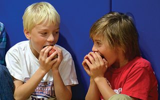 Kindergarteners enjoy their apples during Todd Elementary School's  Big Apple Crunch.