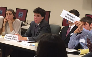 At right, Irvington students Ellie Papapanou, Kieran Sullivan, and Luke Hargraves participating at the Model UN Conference at Fairfield University.