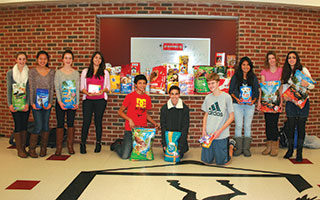 Sleepy Hollow High School  students  celebrate  a successful pet food drive.