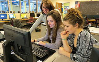 Briarcliff High School Yearbook Club advisor  Nina Marcel worked with student staff members  on layout decisions for the 2015 publication.