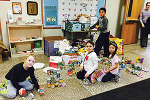 Dows Lane students sort donations to a local animal shelter as part of December's celebration of “Dows Day.”