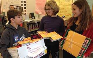 Irvington Middle School students collect packages to send to troops overseas.