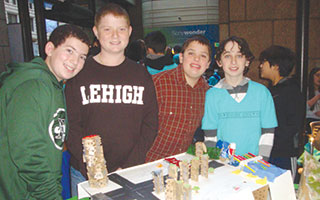 Briarcliff Middle School eighth-grade Future City Club team members (from left) Ben Harris, Josh Ross, Nick Sama and Max Hertz (Caleb Schumacher not pictured) with their award-winning model city, “Goatlantis.”