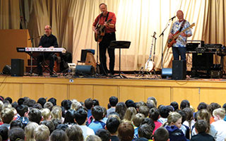 Folk musician Tom Chapin, center, performed with his band mates.