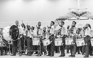 The Marching Cobras of New York, a band comprised of at-risk adolescents with a major contingent from St. Christopher’s, Inc., provide the back drop for Birdman’s final scene.