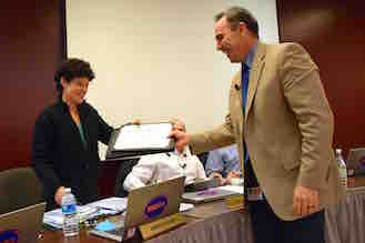 Briarcliff Manor Superintendent of Schools James Kaishian presented Jennifer Rosen with a certificate recognizing her achievement.