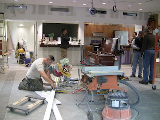 Workers prepare for the completion and dedication of the William J. Vescio Community Center on May 30.