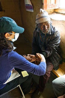 80-year-old man receiving medical attention