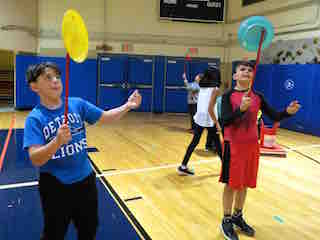 Todd Elementary School students practiced spinning plates when the National Circus Project visited the school.