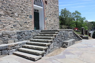 Work continues on twin stairway and handicap ramp leading to the Church and burying ground.