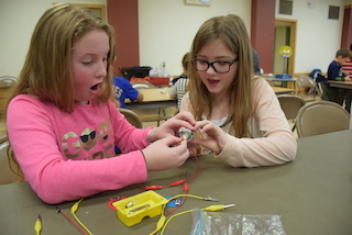 Dows Lane Elementary School students Keira Ruffler and Chloe Macessey were amazed by the All Charged Up Electricity program, part of an interactive Mad Month of Science learning unit funded by the Irvington Education Foundation.