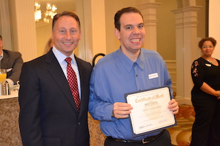 County Executive Robert P. Astorino congratulates Joseph Lombardozzi, from Mamaroneck, during the National Disability Employment Awareness Breakfast in Tarrytown on Oct. 6, 2017. 
