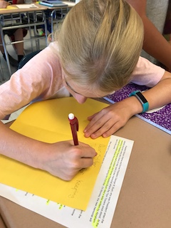 Anne M. Dorner Middle School sixth-grader Emma Stein writes a letter to an active-duty service member on 9/11.