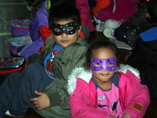 Kindergarteners Matthew Paute and Nayeli Ovalle donned masks and enjoyed the Super Readers’ onstage antics.