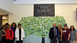 Anne M. Dorner Middle School PTA members, teachers and administrators are proud of the PTA-created Giving Tree wall in the cafeteria that encourages students to tape messages about kindness to the tree.