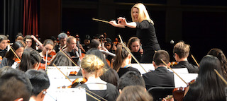 Brittney Trenczer conducts the Sleepy Hollow Middle School Orchestra at the Winter Concert.