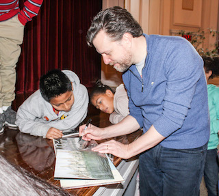 Author and illustrator Mark Siegel meets with young authors after his presentation at Washington Irving School.