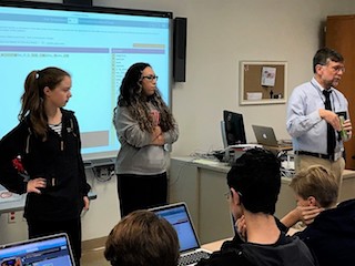 BHS students Emilie Mazzola and Emily Sam-Zee-Moi delved into the Hour of Code with J.P. Fasano, BHS mathematics and computer science teacher.