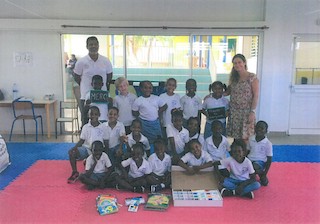 Students from the Eliane Clarke Elementary School on the island of St. Martin, with school supplies donated by Irvington Middle School students and teacher Deanna Tessler.